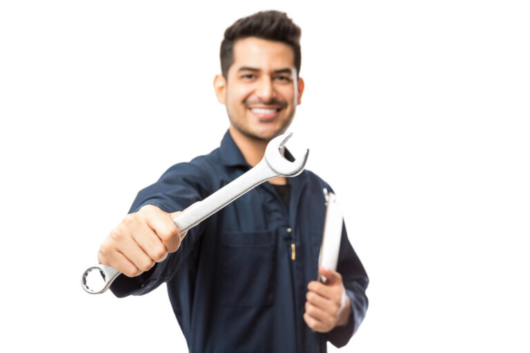 confident-smiling-male-mechanic-showing-wrench-against-white-background (1)